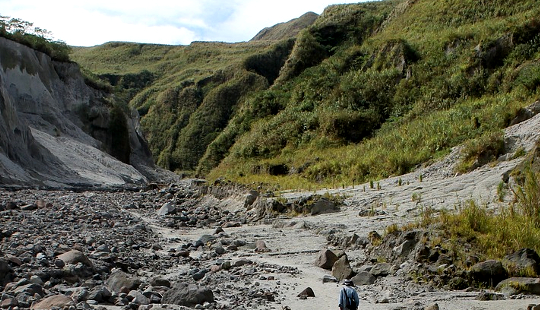 Listening to Your Partner's Premonitions: Another VW Van Misadventure a rough trail in the mountains with a lone hiker