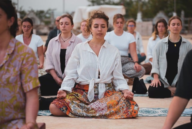 Understanding and Utilizing Collective Consciousness a group of women sitting together and meditating
